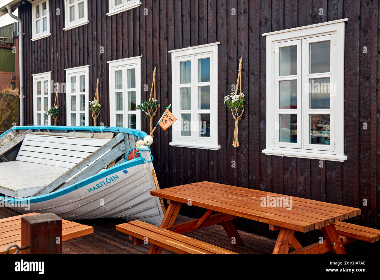 Boat Bench in Front of the Sjavarpakkhusid Seafood Restaurant, Stykkishólmur, Iceland Stock Photo