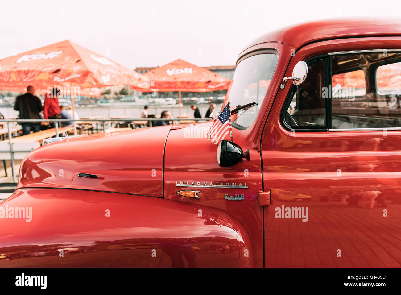 Prague, Czech Republic - September 23, 2017: Close Side View Of Red International Harvester R-series Truck With Small American Flag Parked In Street. Stock Photo