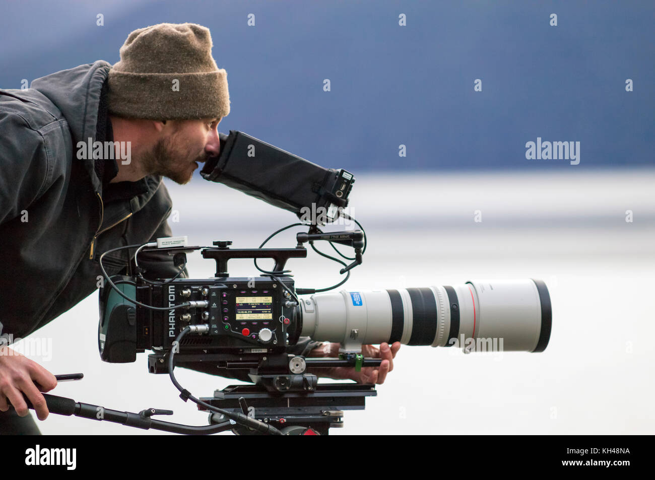 Nick operating the high speed Phantom Flex 4K video camera with the Canon 200-400mm f4.0 zoom lens on a shoot in Alaska, USA. Shooting at 960 fps. at  Stock Photo