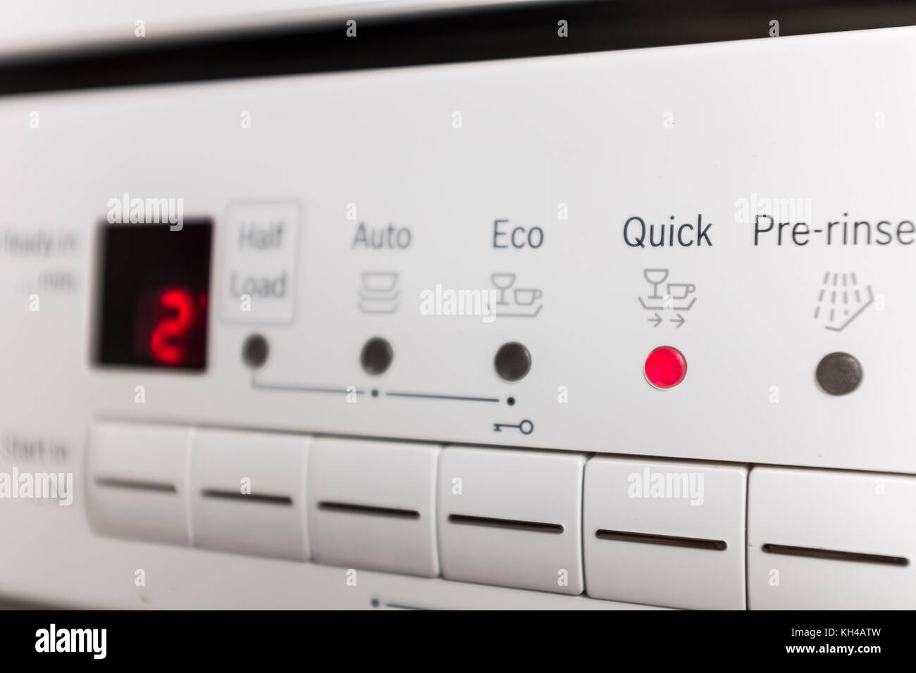 Control panel of white dishwasher set at Quick wash mode Stock Photo