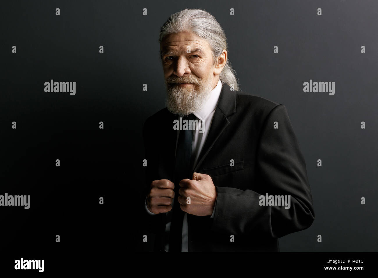 Stylish old man in black jacket. Stock Photo