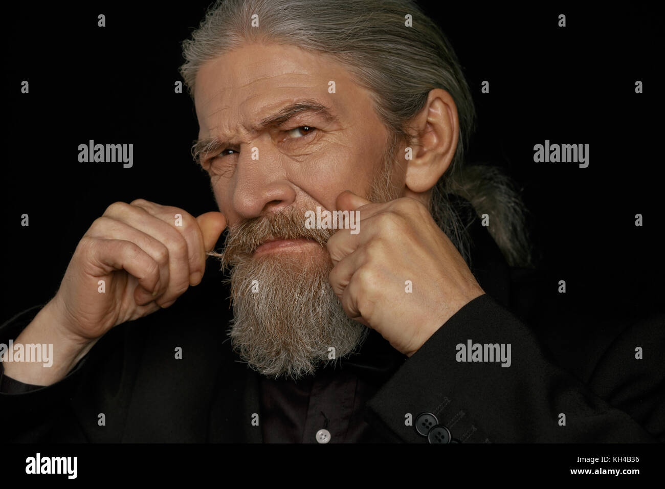 Strict look of very old beardy man. Stock Photo