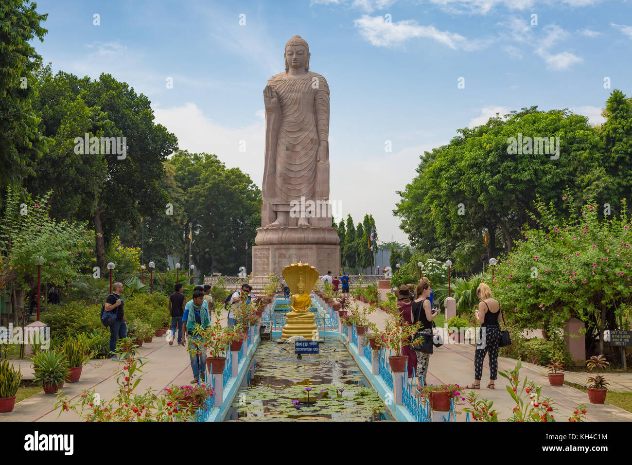 Gigantic sculpture of standing Buddha 80 feet tall at Wat Thai monastery Sarnath, Varanasi, India. Stock Photo