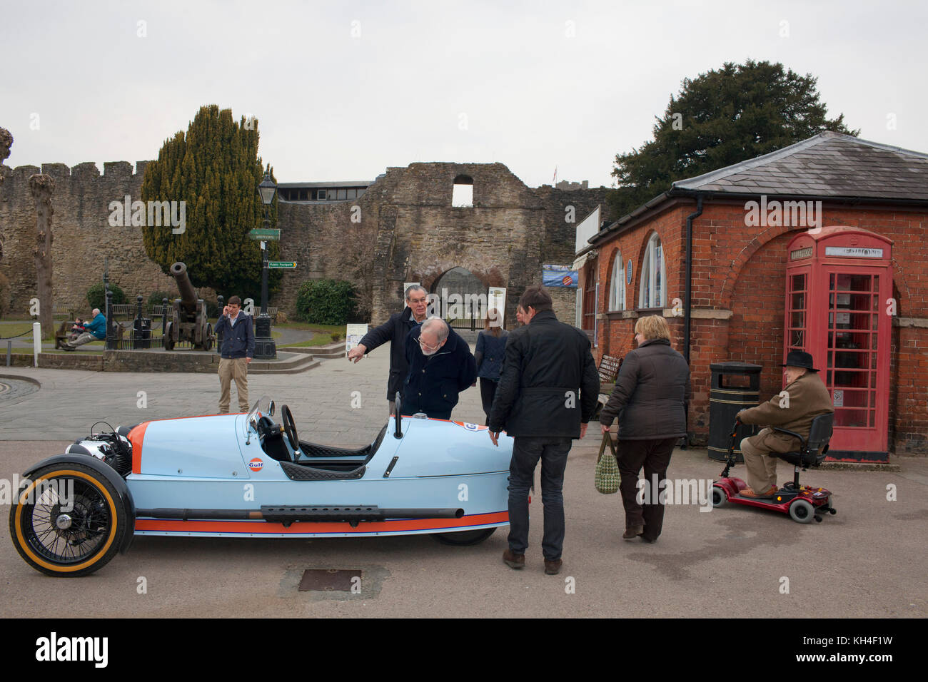 A 3 wheeler parked in the centre of the town of Ludlow. The