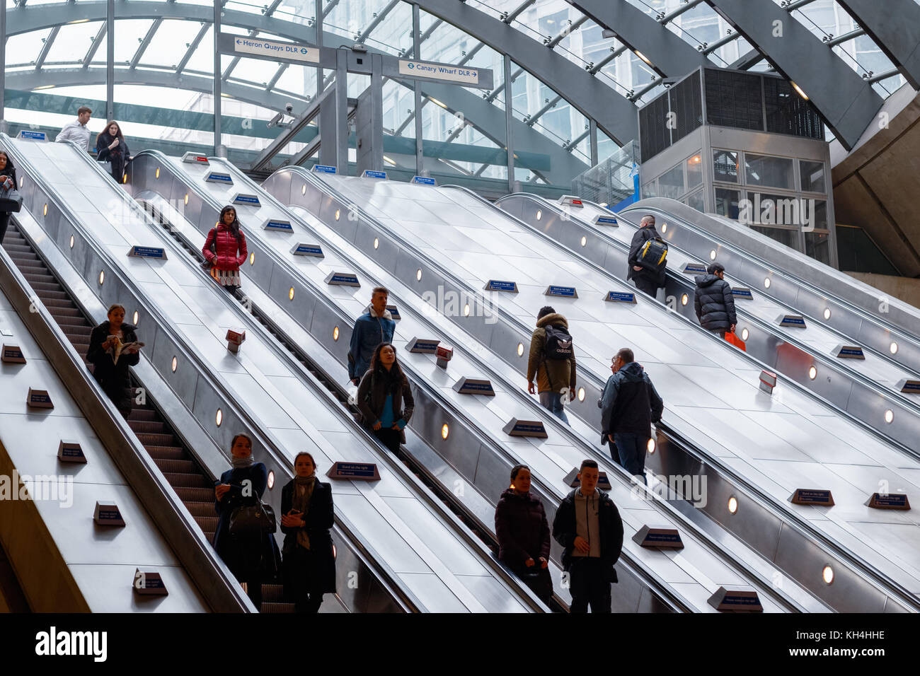 London, UK - November 24, 2017 - Entrance of Canary Wharf underground station with commuters on escalators Stock Photo