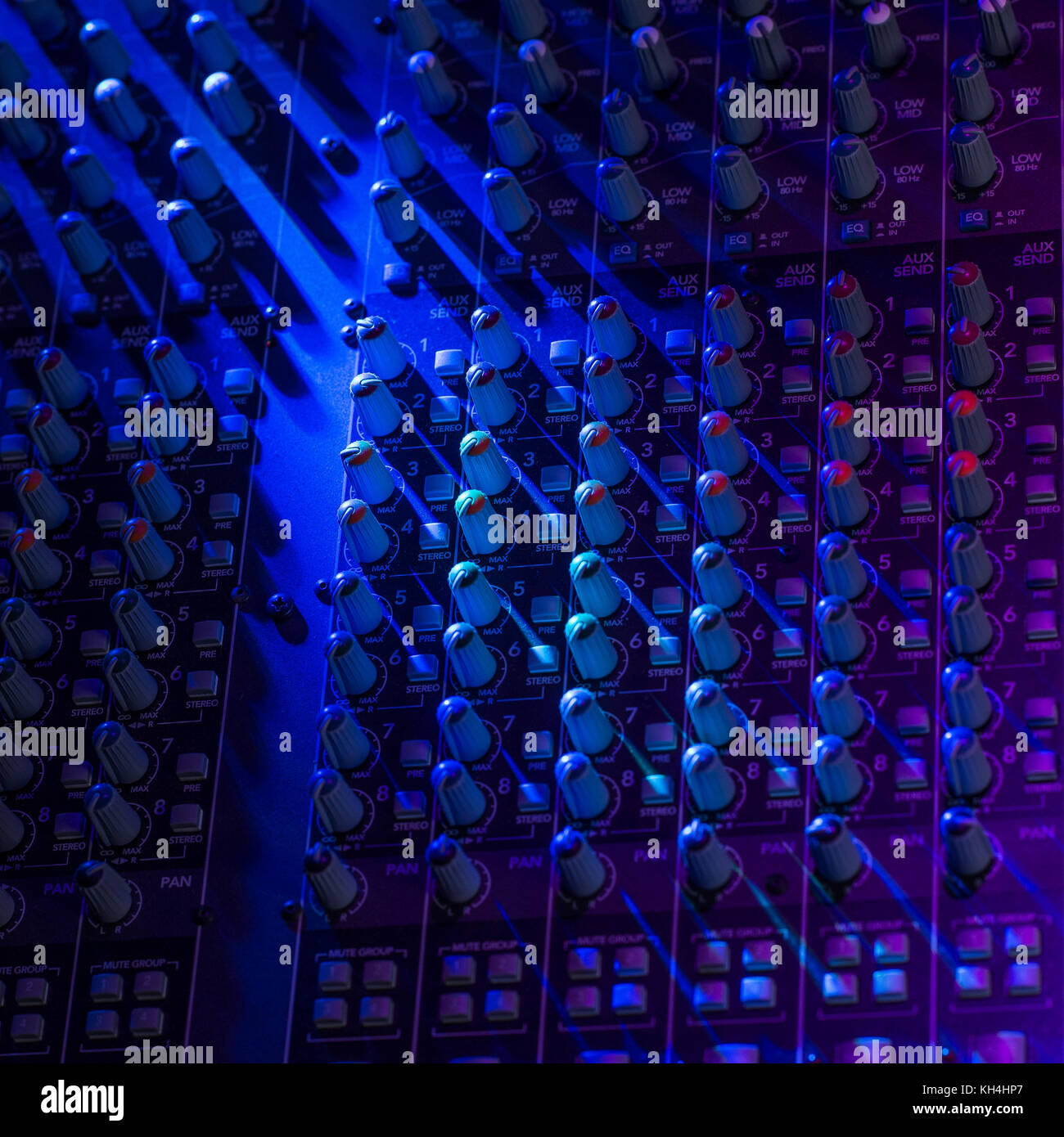 Sound music mixer control panel on colourful light, France Stock Photo