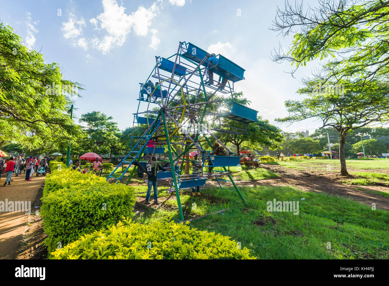 Fairground amusement rides with children on in Uhuru Park, Nairobi, Kenya Stock Photo