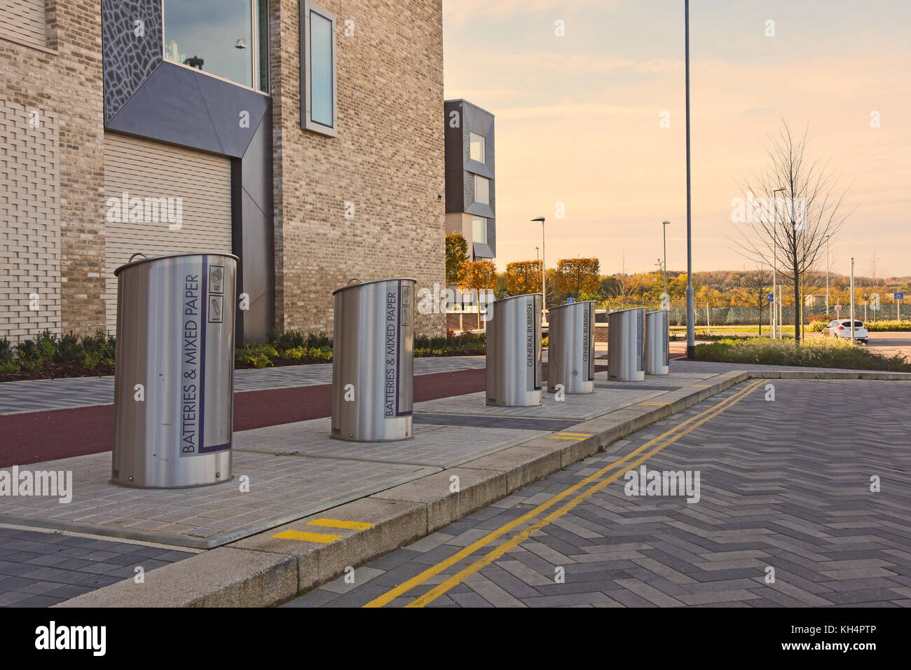 Row of unique recycling bins where material is stored below ground