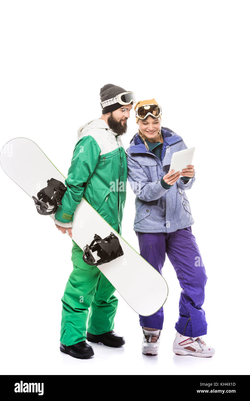 couple of snowboarders with tablet Stock Photo