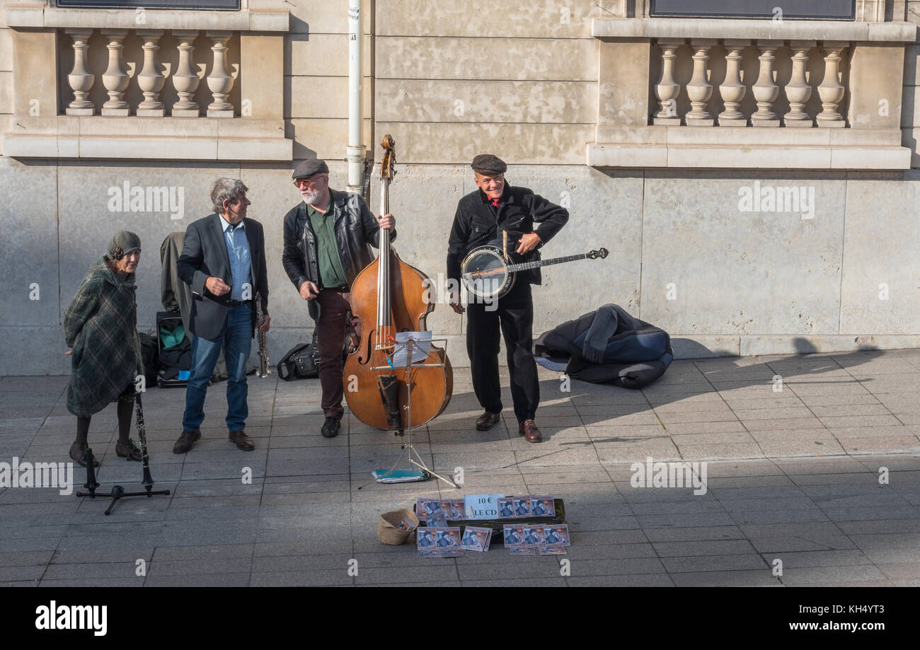 Paris, France -- November 7, 2017 -- Street musicians playing on the sidewalk in the heart of Paris.  Editorial Use Only. Stock Photo
