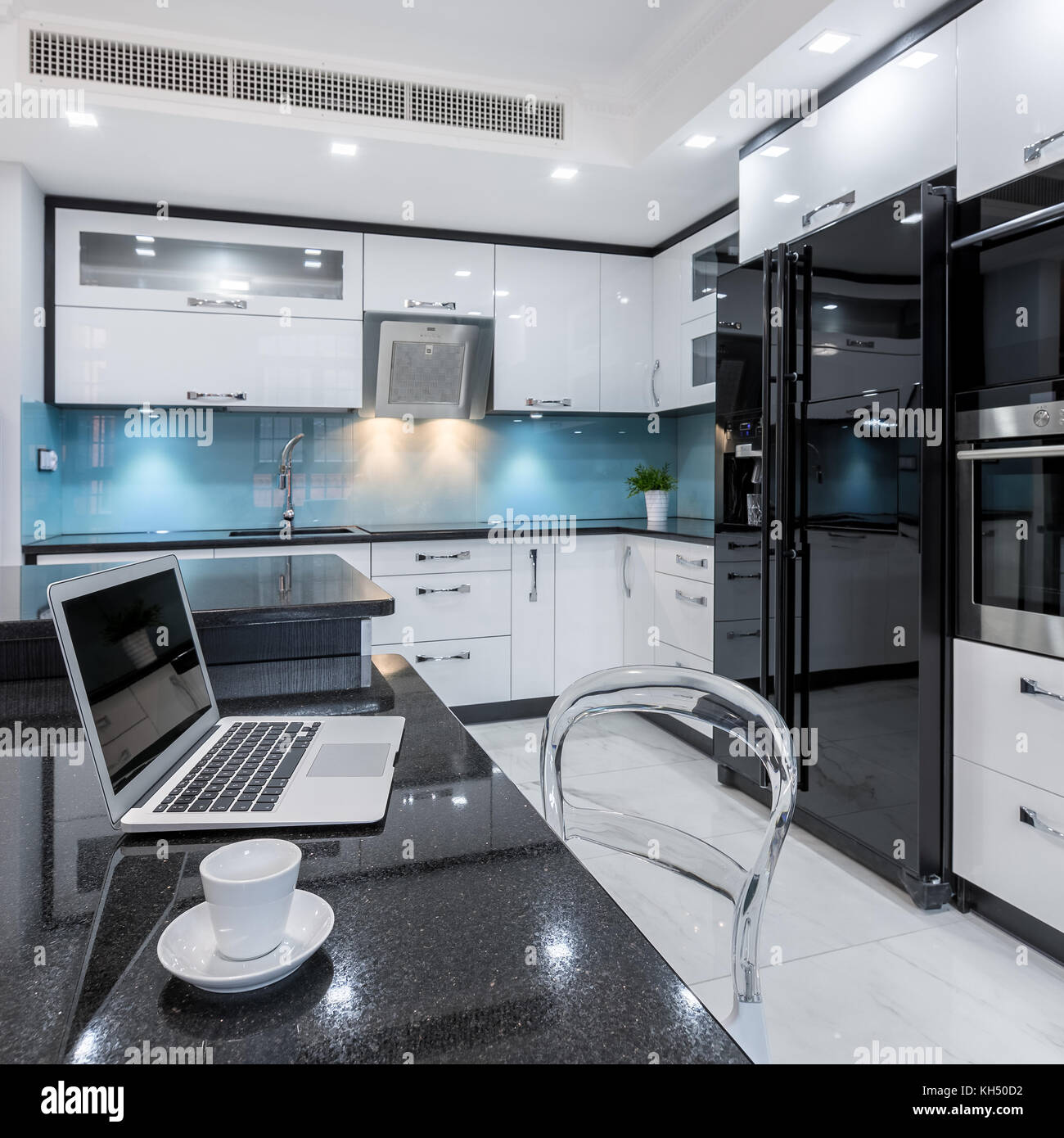 Comfortable place to work combined with modern kitchen interior Stock Photo