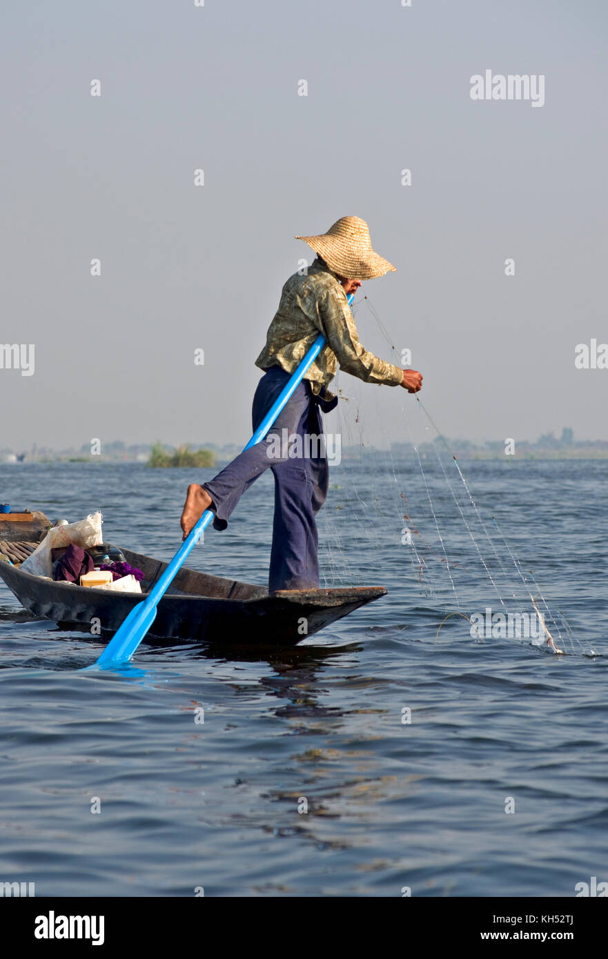 Fisherman rowing with one leg in Inle Lake Myanmar, Burma Stock Photo