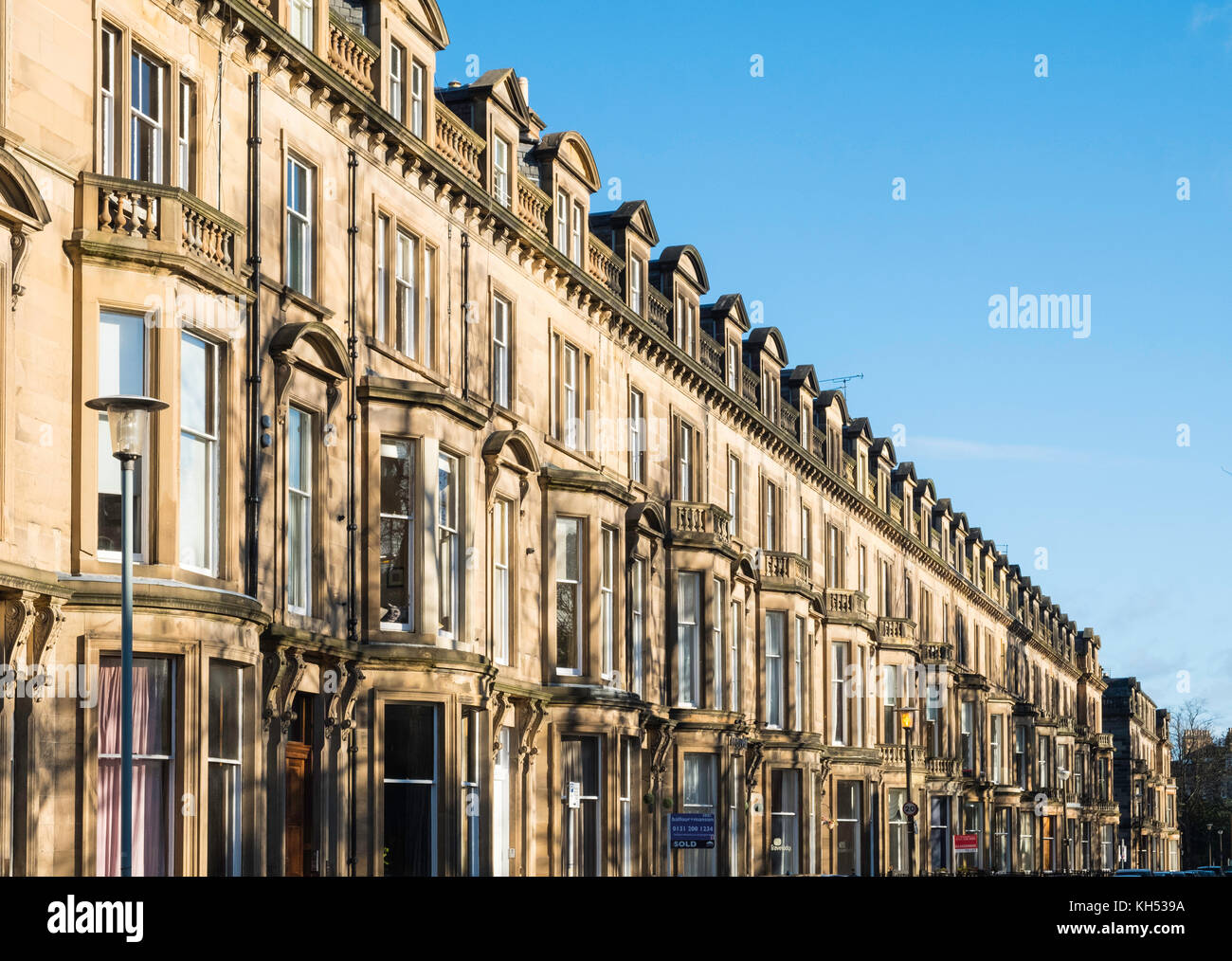View of row of sandstone terraced apartments (tenements) on Learmonth Terrace in Edinburgh, Scotland, United Kingdom Stock Photo