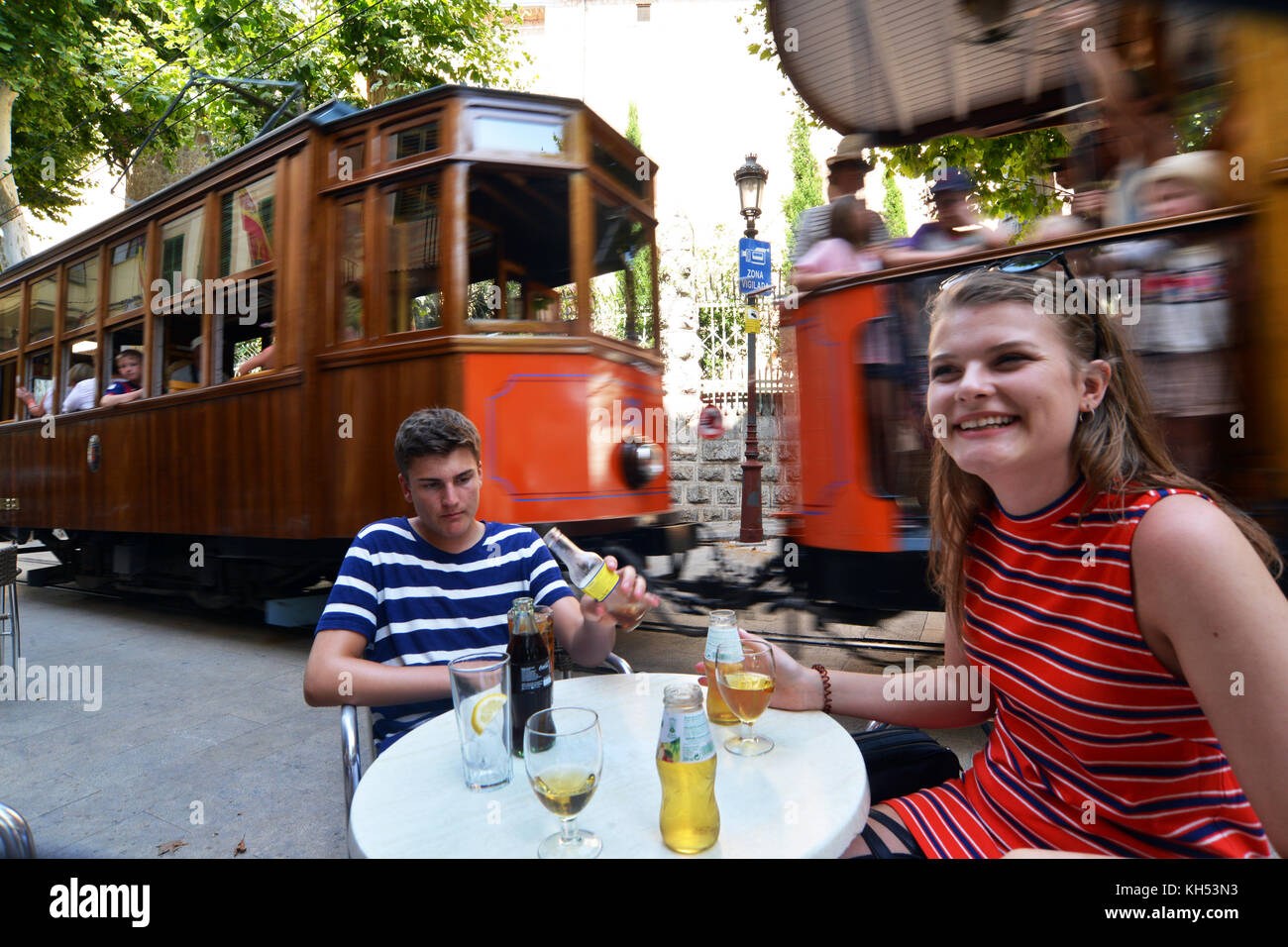 Summer drinks next to a tram on holiday in Soller, Mallorca Stock Photo
