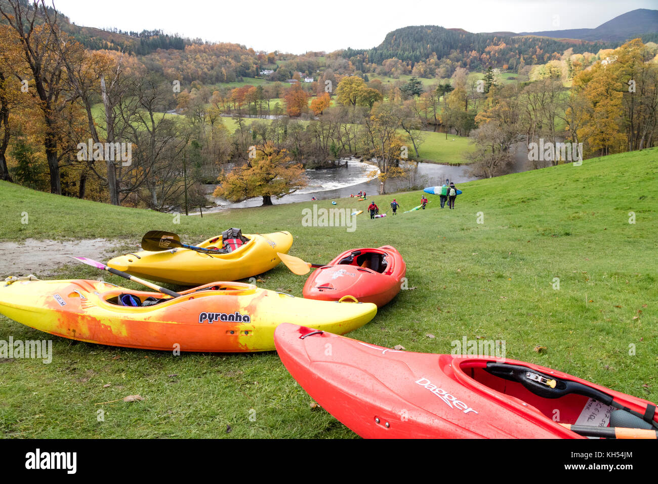 Autumn day and Kayakers on the River Dee at Horseshoe Falls near Llangollen, North Wales, UK Stock Photo
