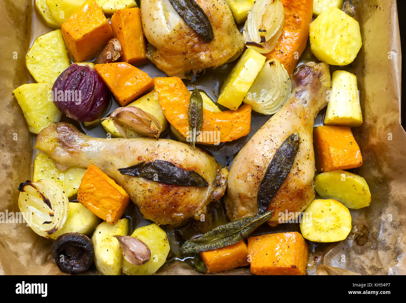 Roasted chicken legs with vegetables, herbs and pumpkin Stock Photo Alamy