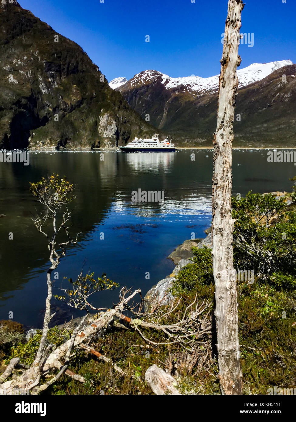 The National Geographic Orion expedition ship near Garibaldi Glacier in the fjords of Chile Stock Photo