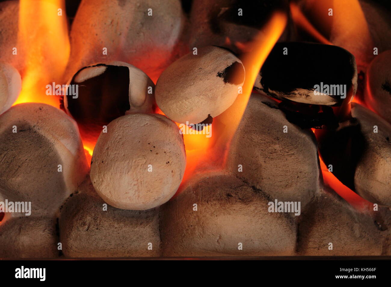 Close Up Of Gas Fire Coals With Yellow Orange Flames Glowing