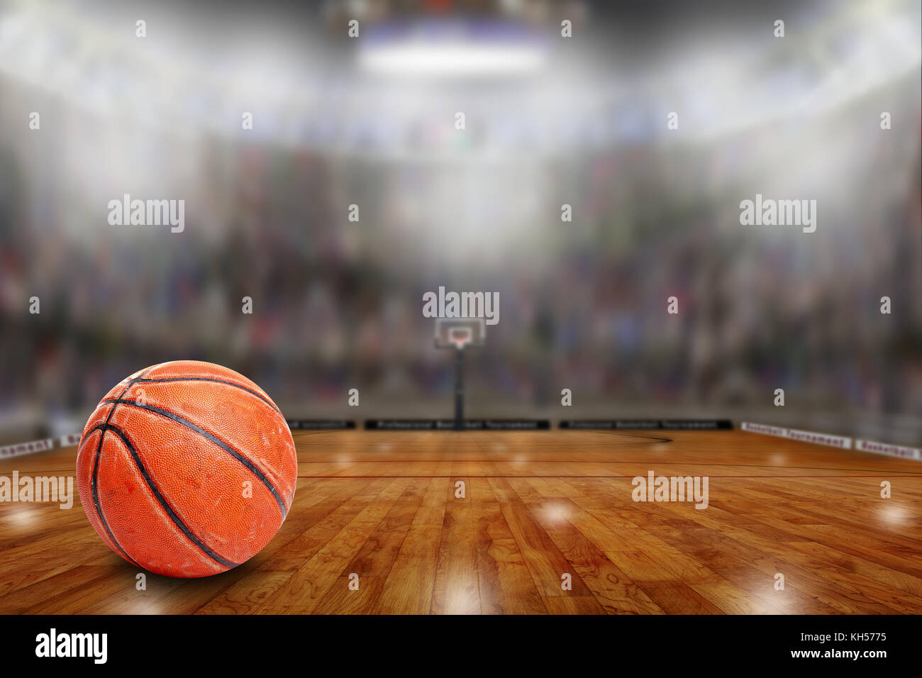 Low angle view of fictitious basketball arena with sports fans in the stands. Focus on foreground with deliberate shallow depth of field on background Stock Photo