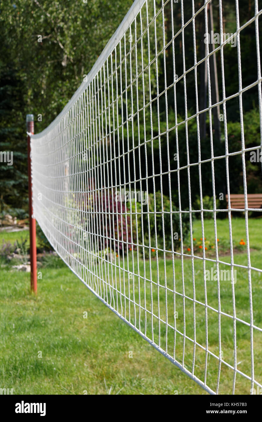 Volleyball net on a background of green grass Stock Photo Alamy