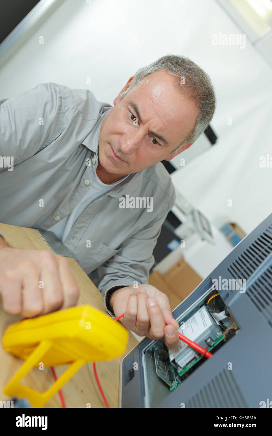 electrician checking fuse box with multimeter Stock Photo Alamy