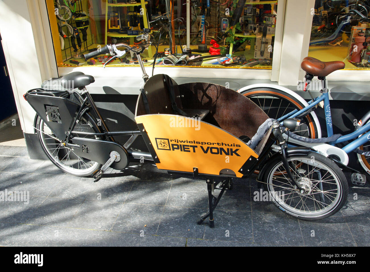 The Dutch-developed cargo bike is ideal for transporting small children and cargo Stock Photo