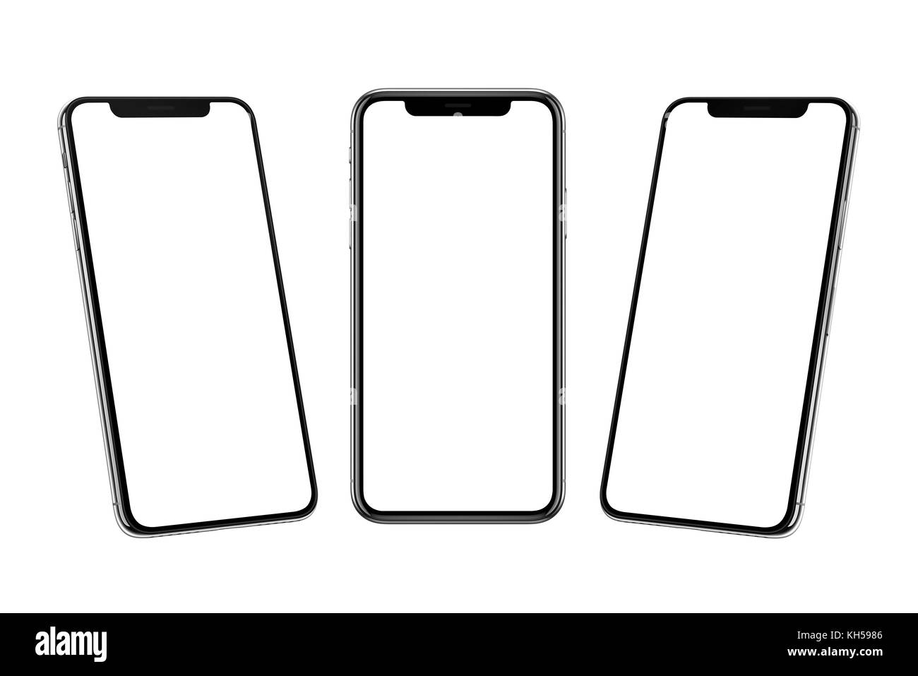 Multiple smart phones with x curved screen in front, left and right side position. Stock Photo