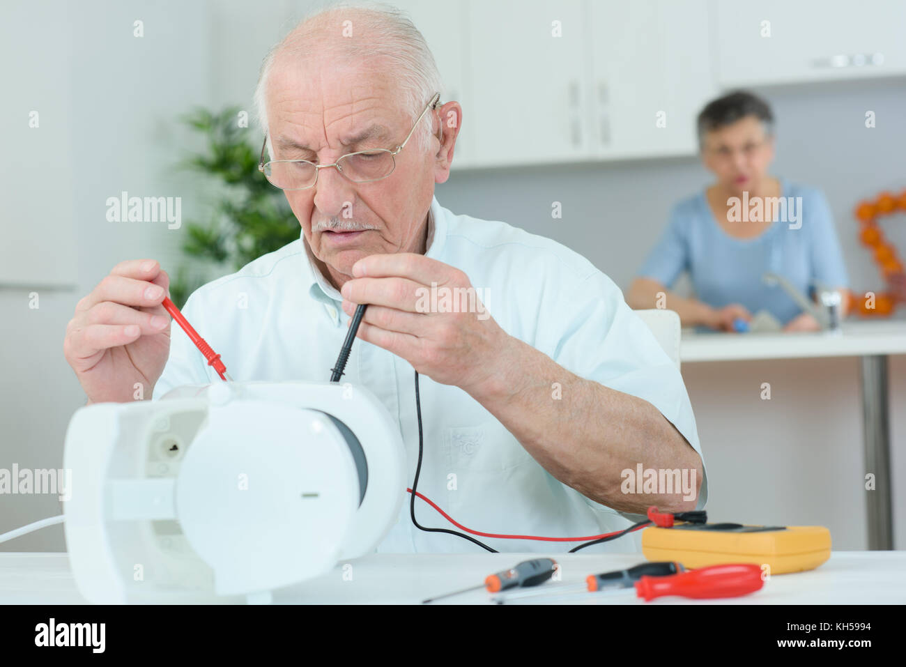 fixing the coffee maker Stock Photo Alamy