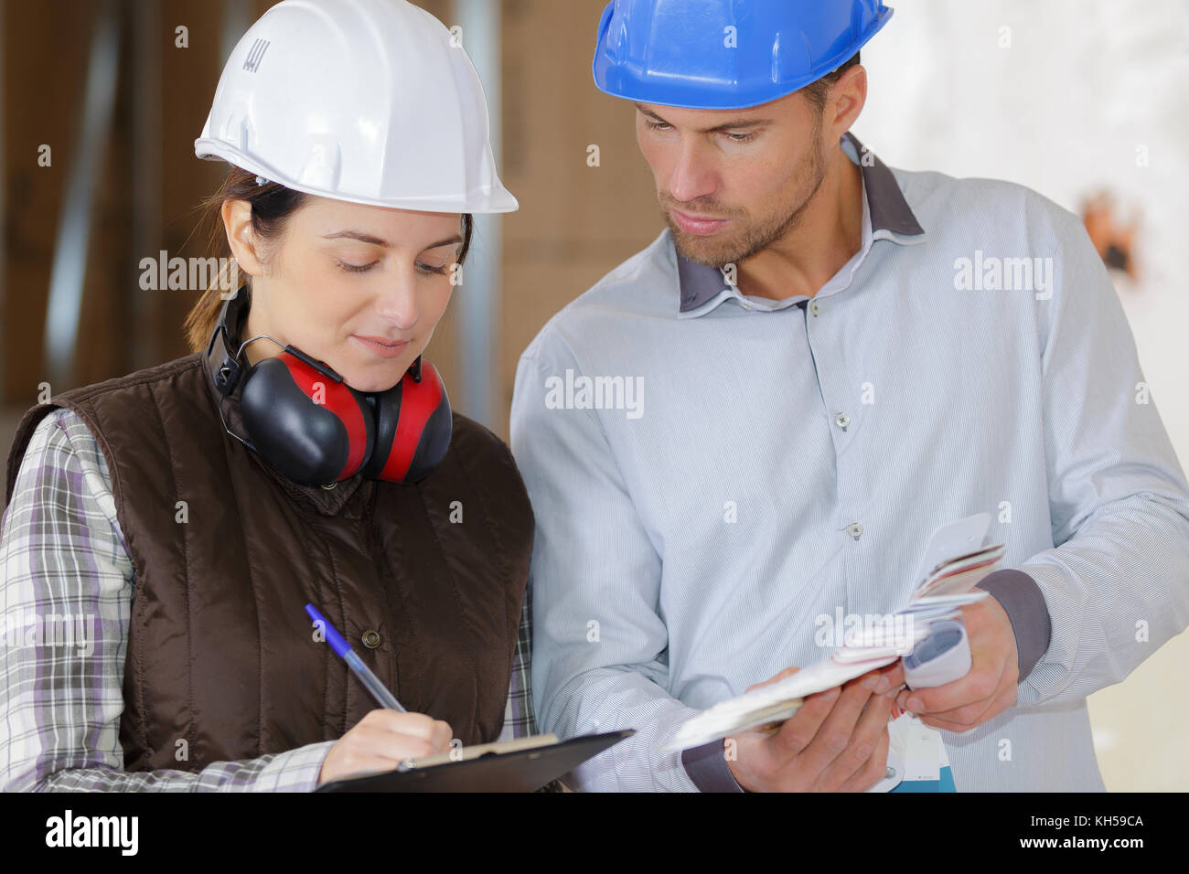 builders together indoors Stock Photo - Alamy