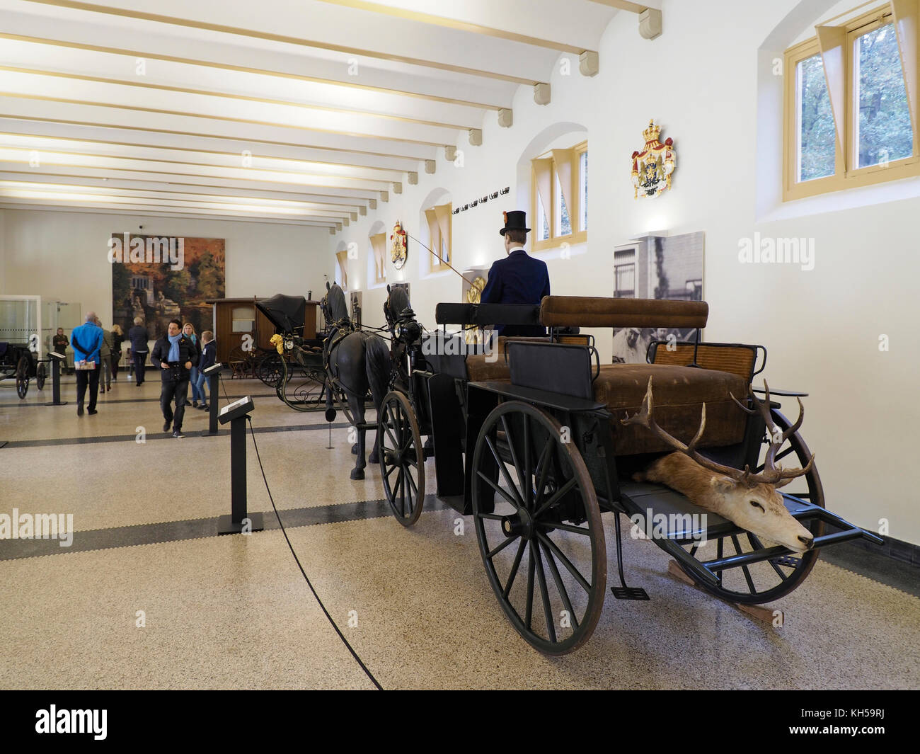 Carriages of the Dutch Royal Family on display in the stables of the het Loo Palace in Apeldoorn, Gelderland, the Netherlands Stock Photo