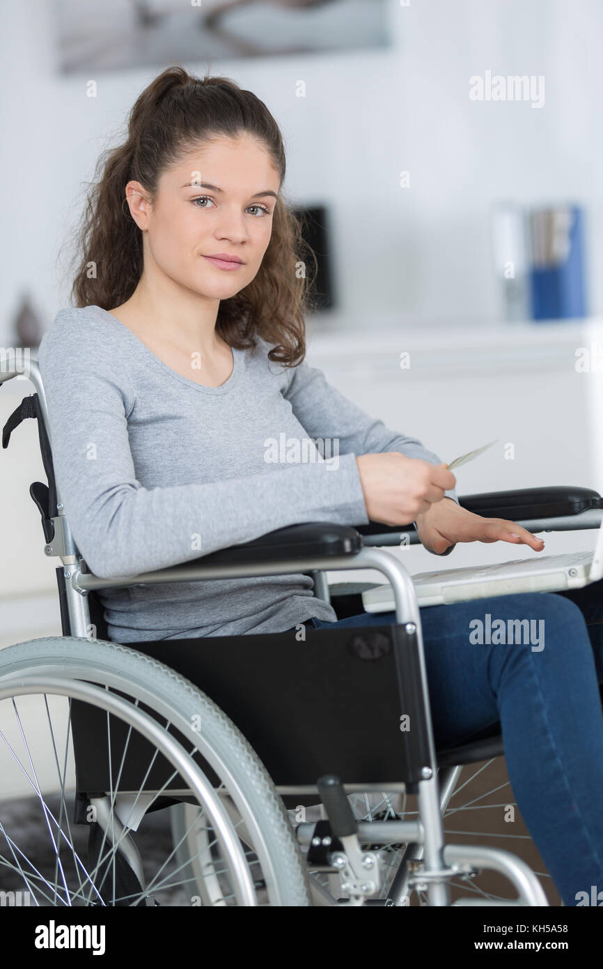 woman in wheelchair using computer Stock Photo - Alamy