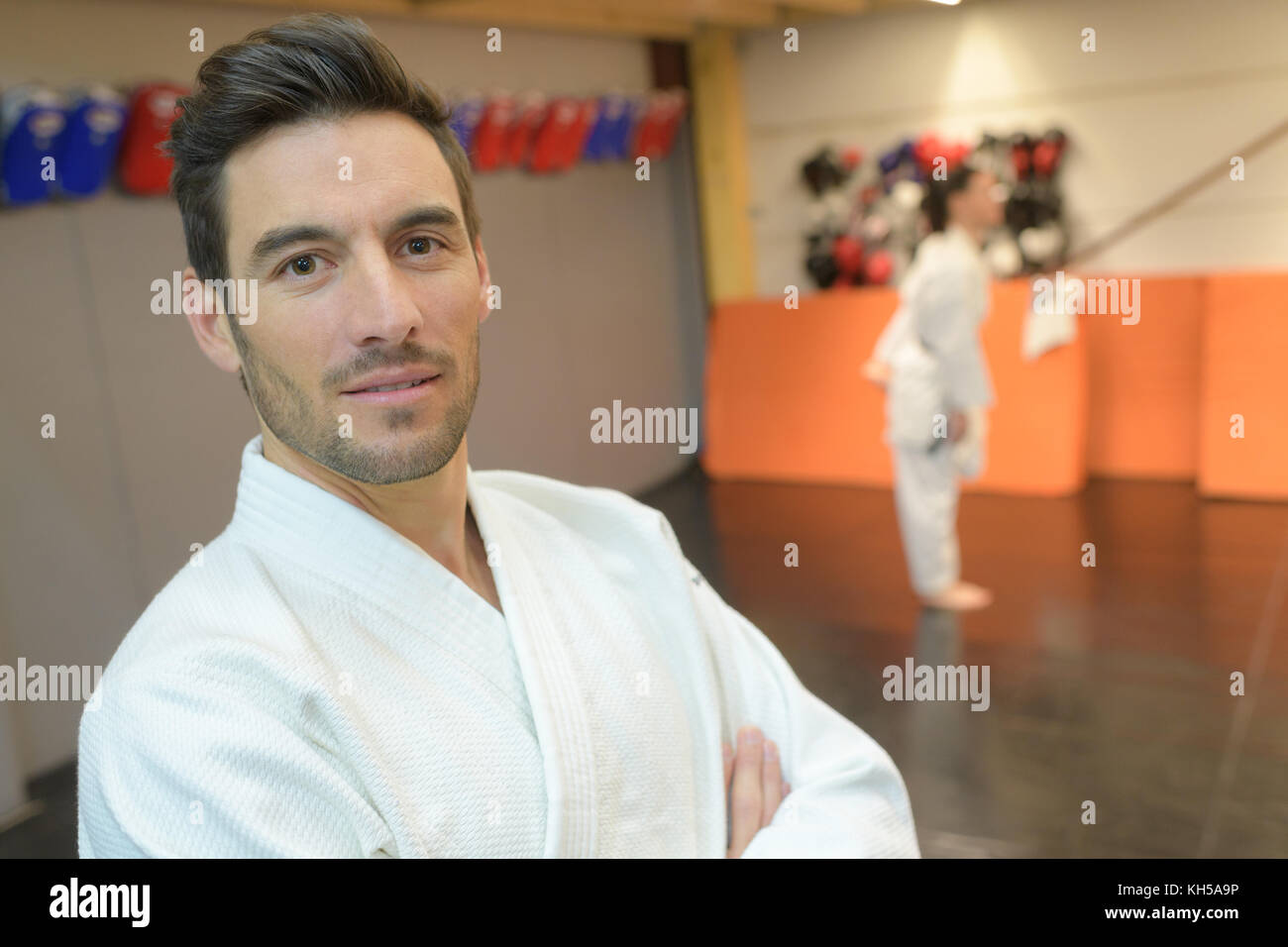 portrait of martial arts student listening attentively to his teacher Stock Photo