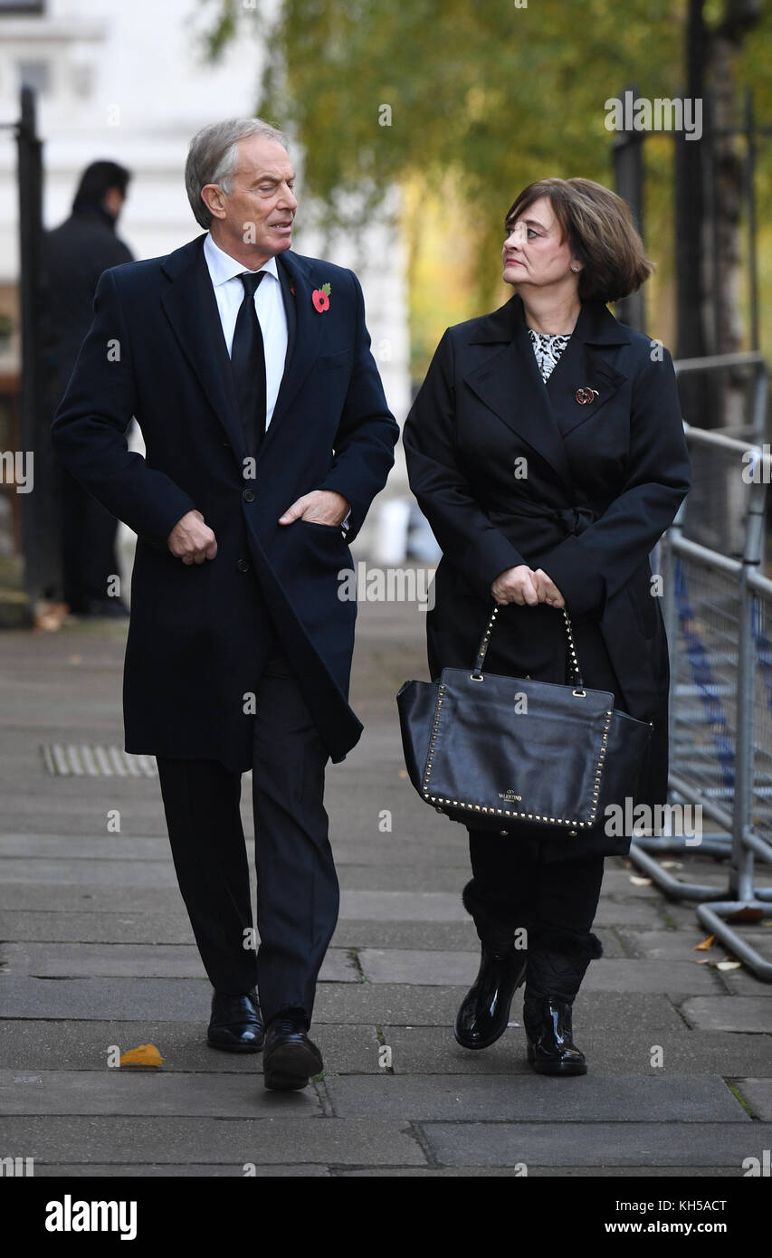 Former Prime Minister Tony Blair and his wife Cherie walk through