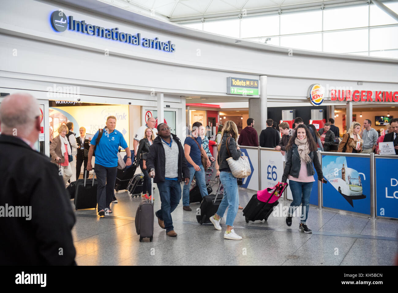 People arriving into UK via International Arrivals at Stansted Airport