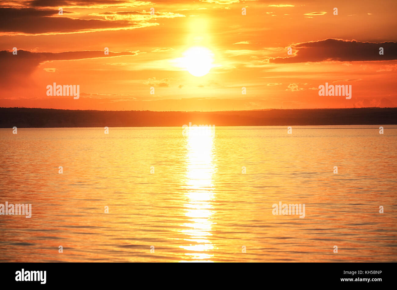 Beautiful sunset above the river Stock Photo - Alamy