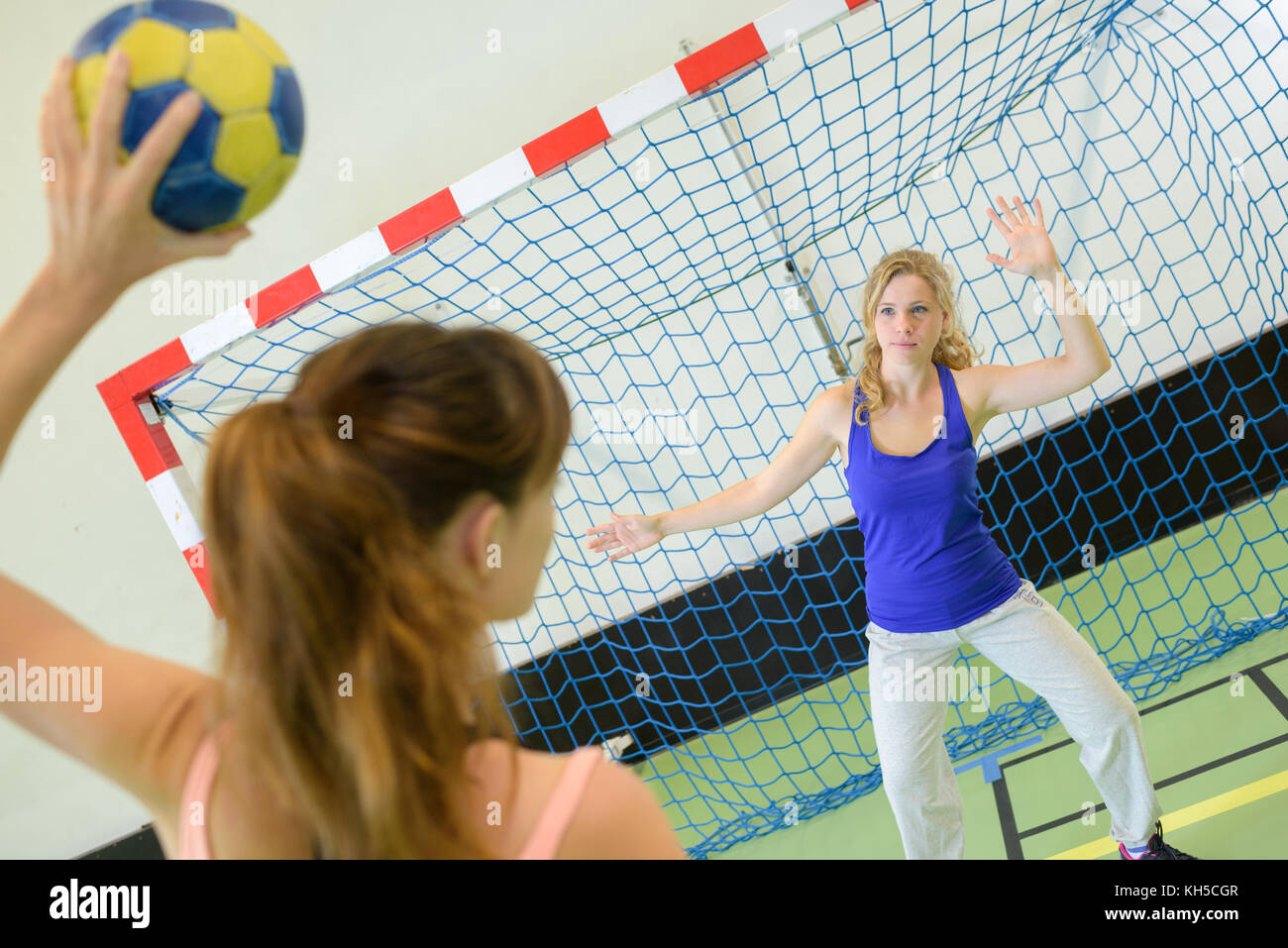 woman about to score during handball match Stock Photo Alamy