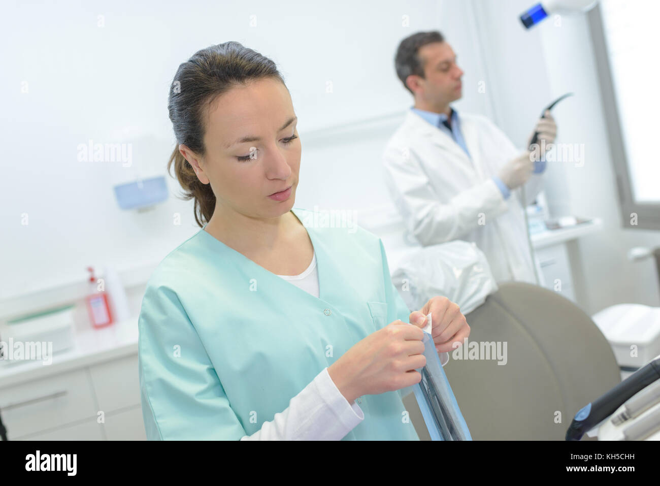 Dental workers preparing equipment Stock Photo Alamy