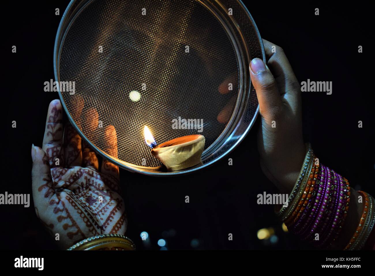 Karva Chauth is festival celebrated by Hindu women in Northern India, in which married women fast from sunrise to moonrise for safety of his husband Stock Photo