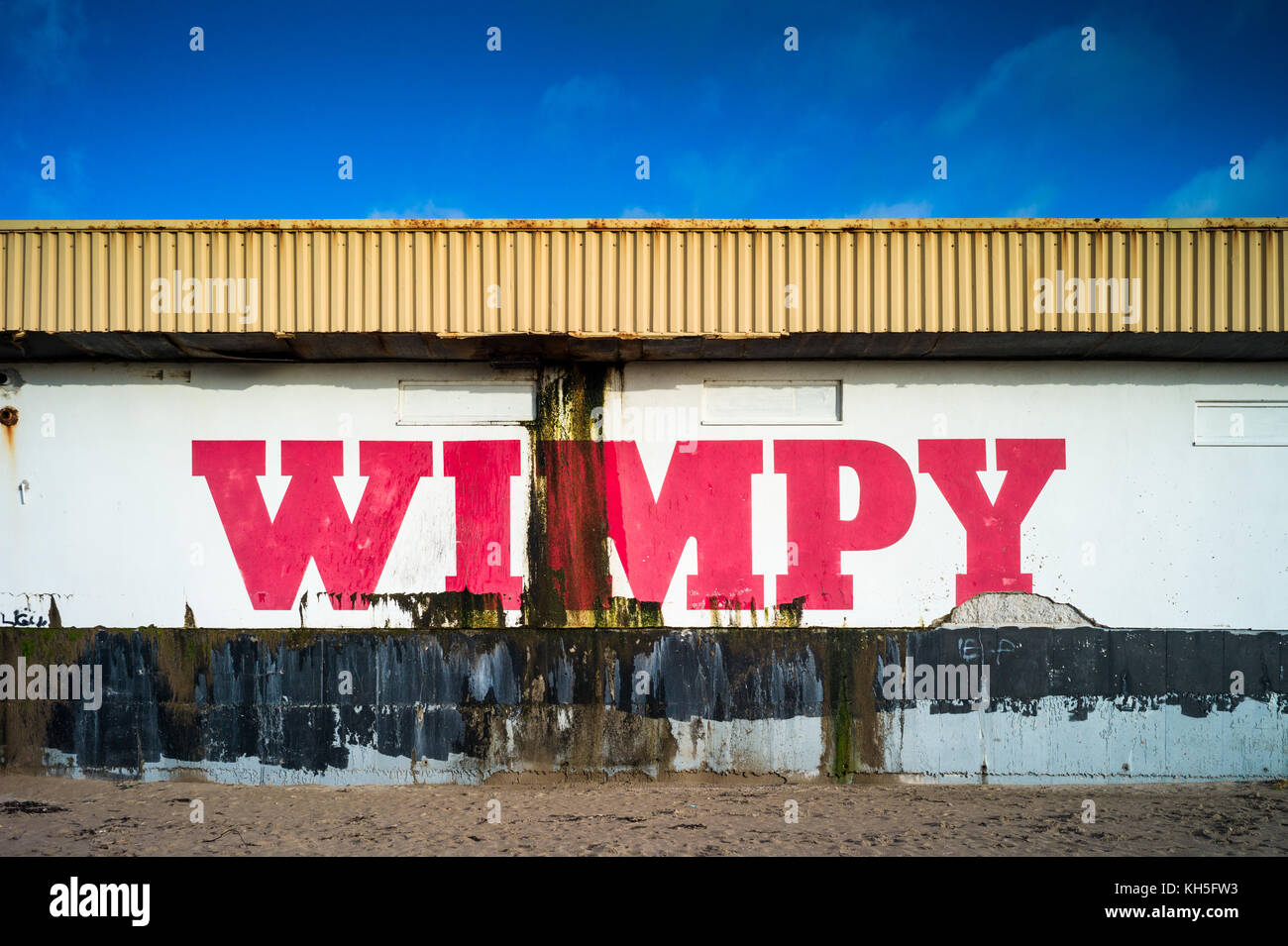 Seaside Wimpy Bar Restaurant in Porthcawl in South Wales. The weathered beachside restaurant is near the Coney Beach funfair. Stock Photo