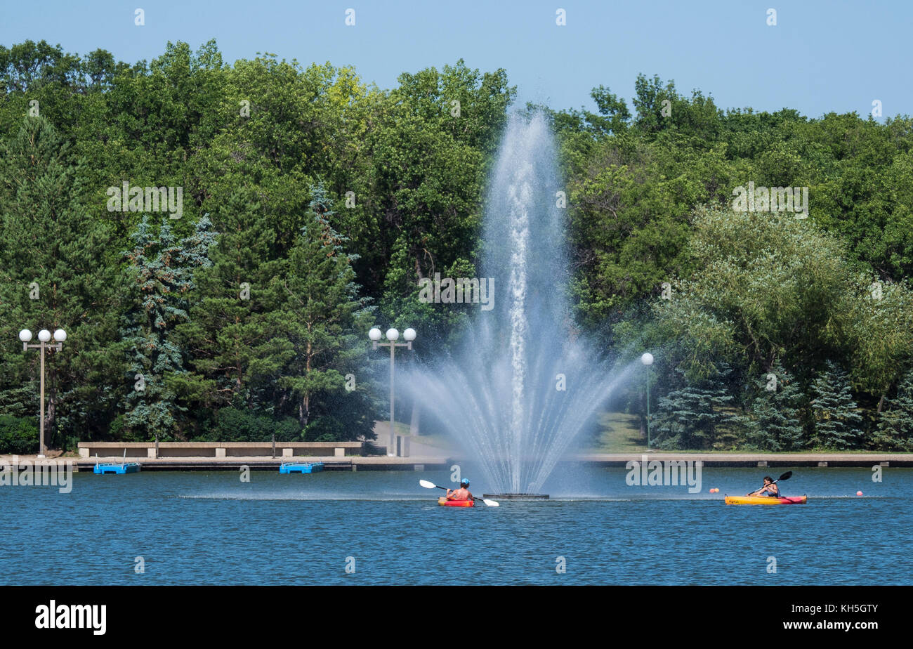 Kayakers and fountain, Wascana Lake, Regina, Saskatchewan, Canada. Stock Photo