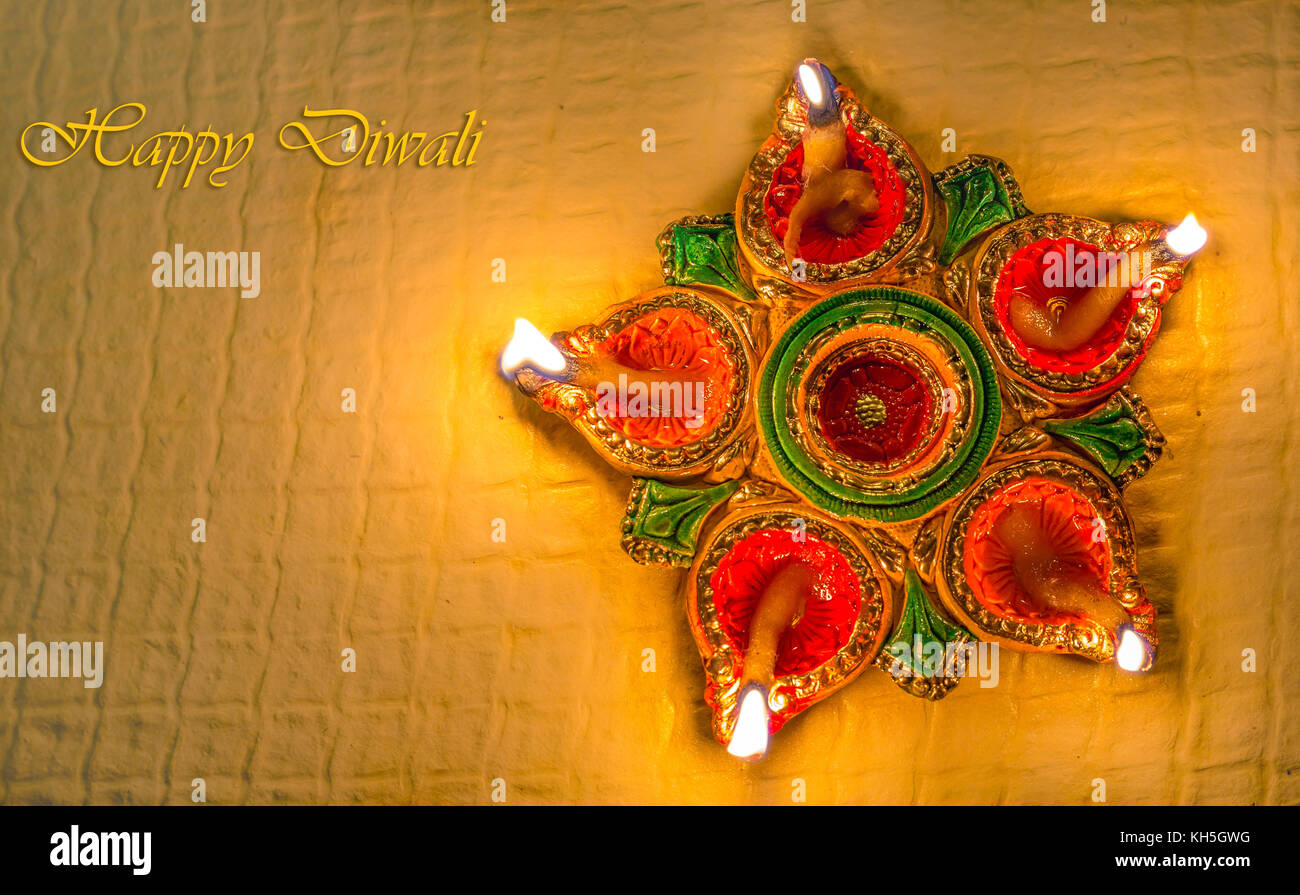 Diwali colorful decorative clay diya lamps for background greetings