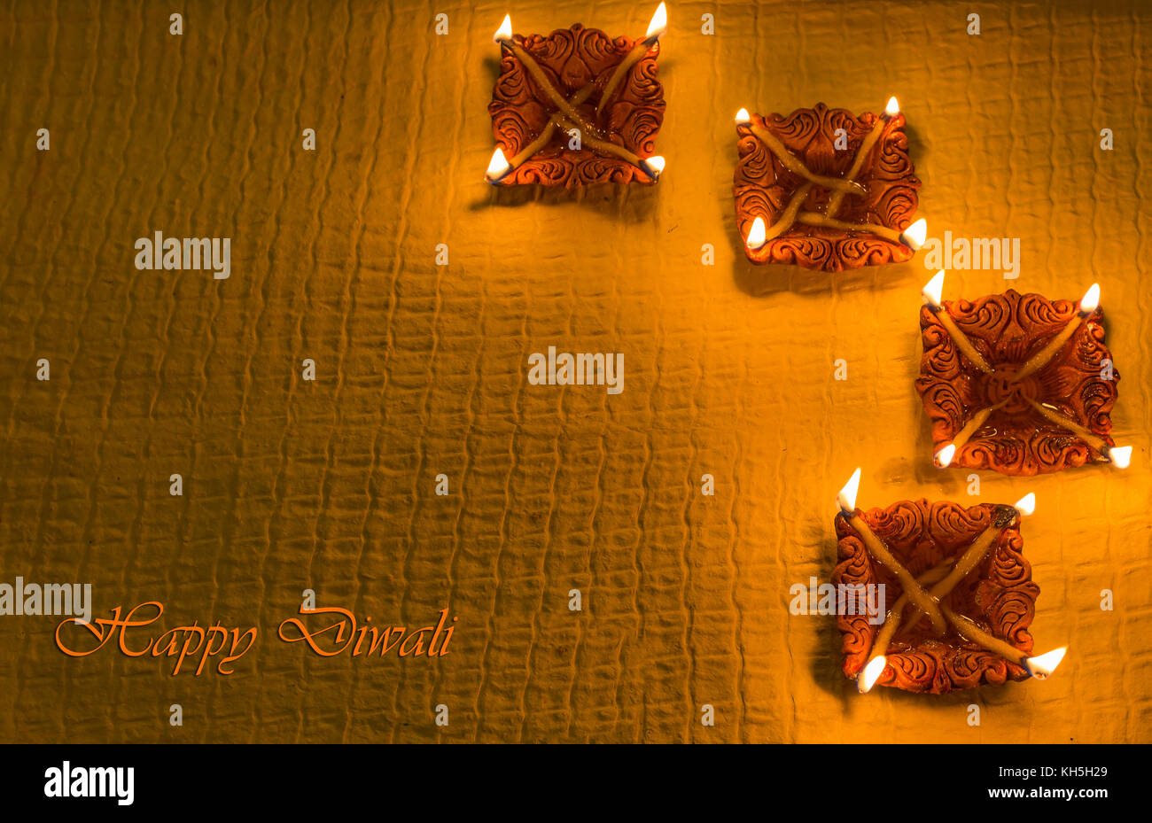 Diwali colorful decorative clay diya lamps for background greetings content Stock Photo