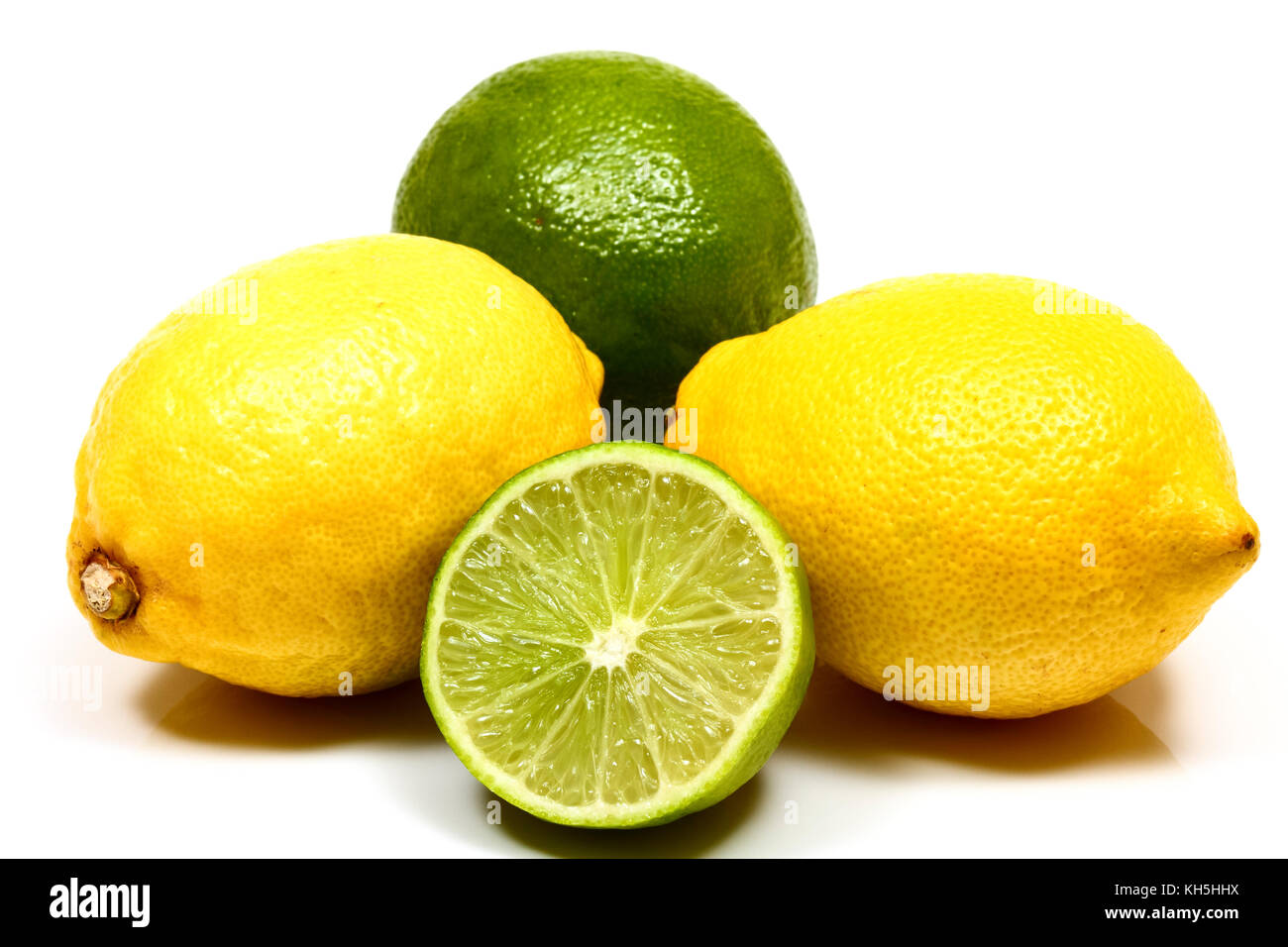 Studio shot image of fresh organic juicy lemons and limes isolated on a white background Stock Photo
