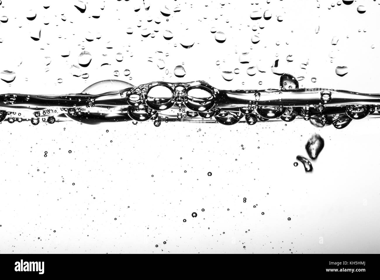 Close up underwater view of oxygen bubbles rising to the surface Stock Photo