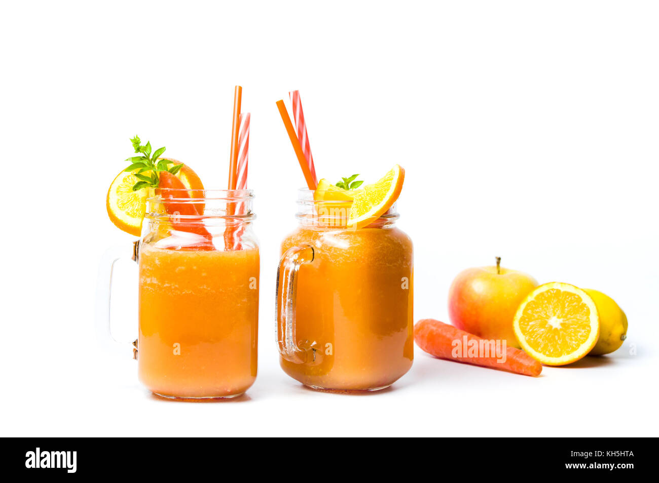 Healthy carrot and orange smoothie in a jar isolated Stock Photo