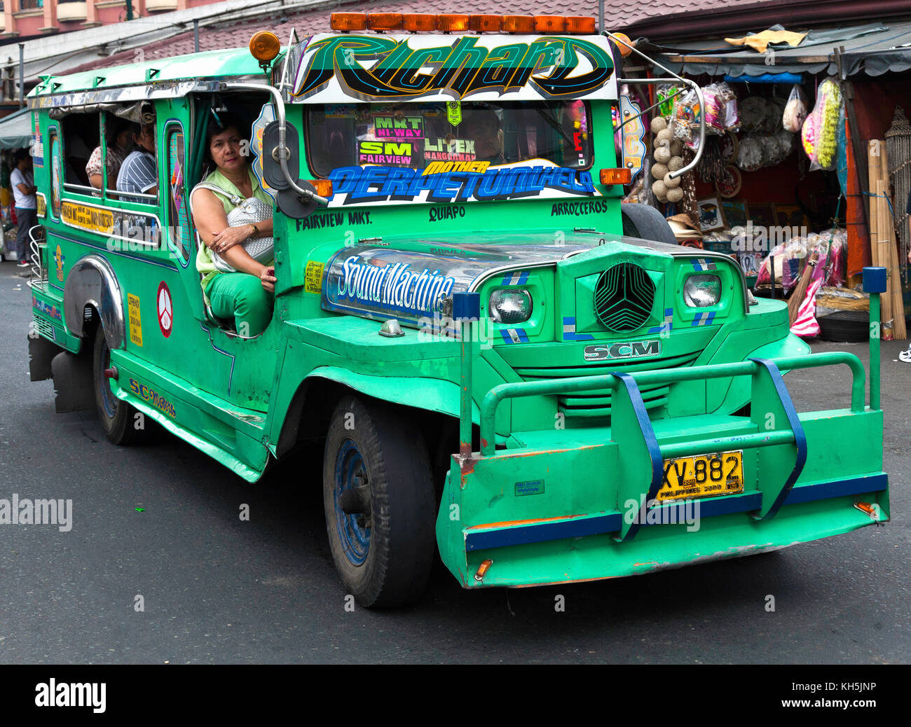 Jeepneys, the Philippine version of a taxi and minibus, are roaming the streets of Manila, Philippines Stock Photo
