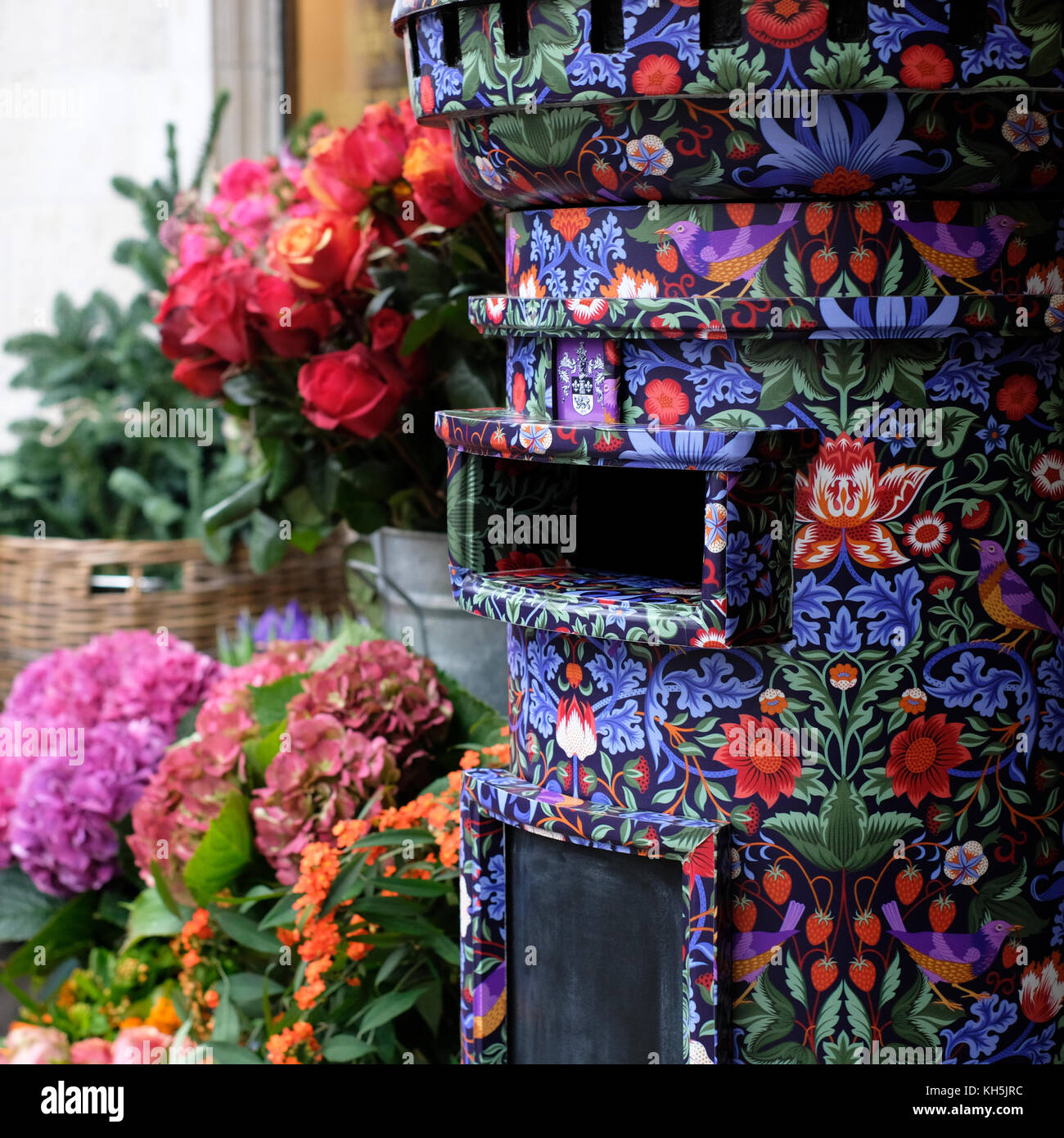 Postbox covered in Liberty print, located in the flower shop outside