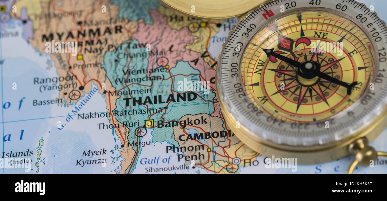 Compass on a close up map pointing at Thailand and planning a travel destination Stock Photo Alamy