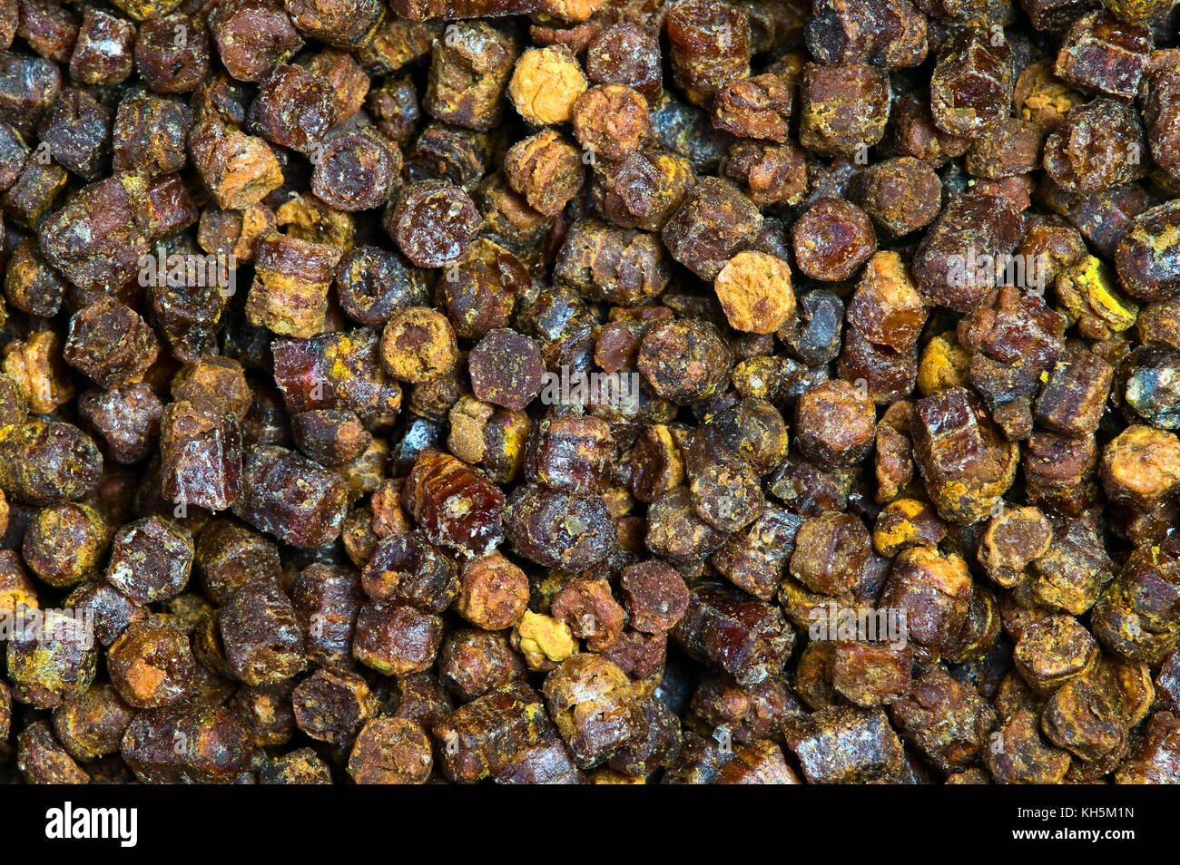 Propolis granules grunge texture background, bee product Stock Photo