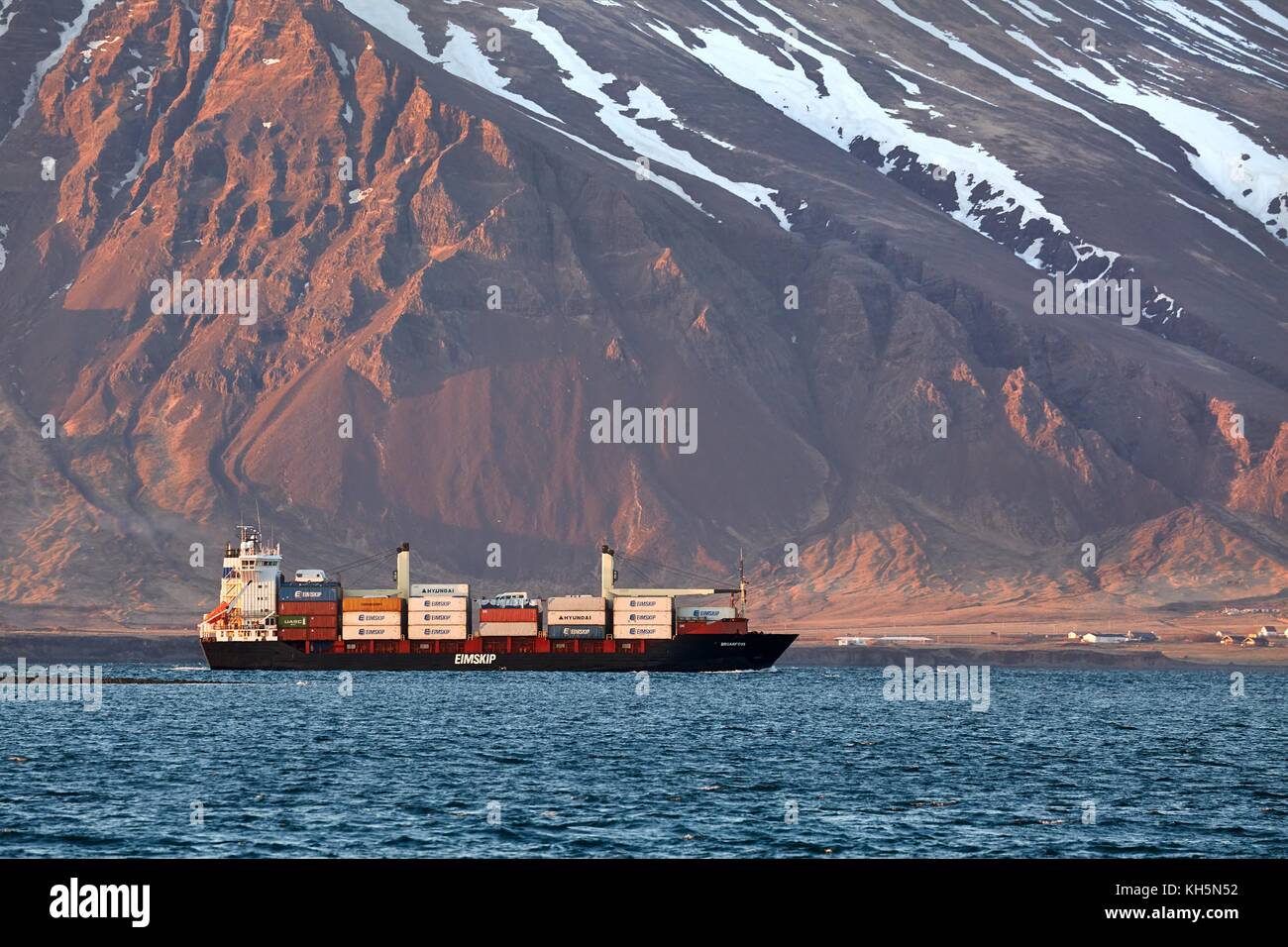 Container ship arriving Stock Photo